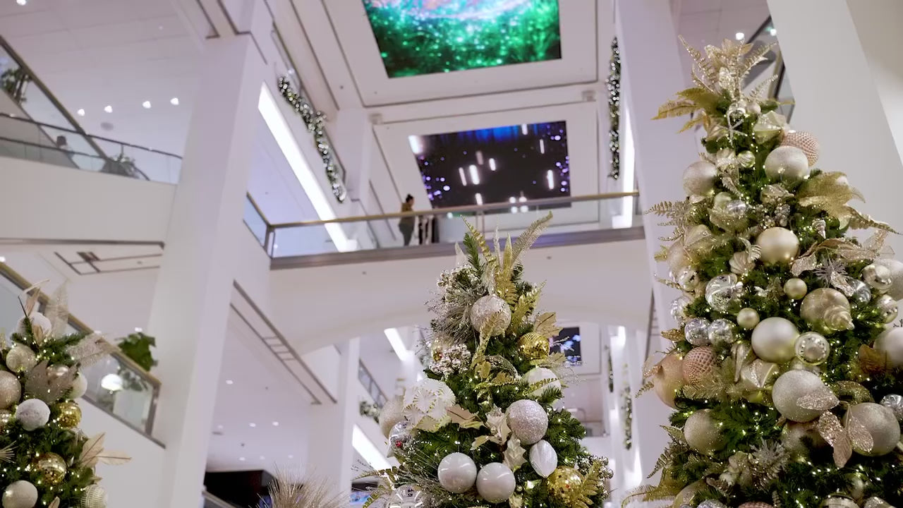 Load video: a child visits with a magical santa in a giant vintage red sleigh in chicago at the shops at 900 north michigan avenue